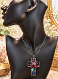 Wire-wrapped cross pendant necklace with magenta stone