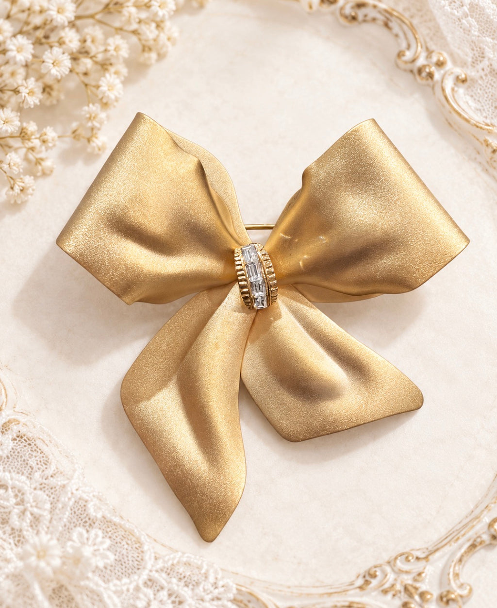 Vintage Gold-Tone Ribbon Bow Brooch with Baguette Crystal Knot