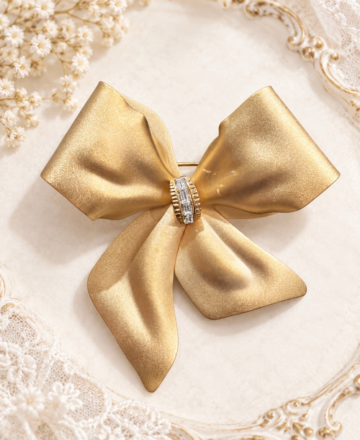 Vintage Gold-Tone Ribbon Bow Brooch with Baguette Crystal Knot